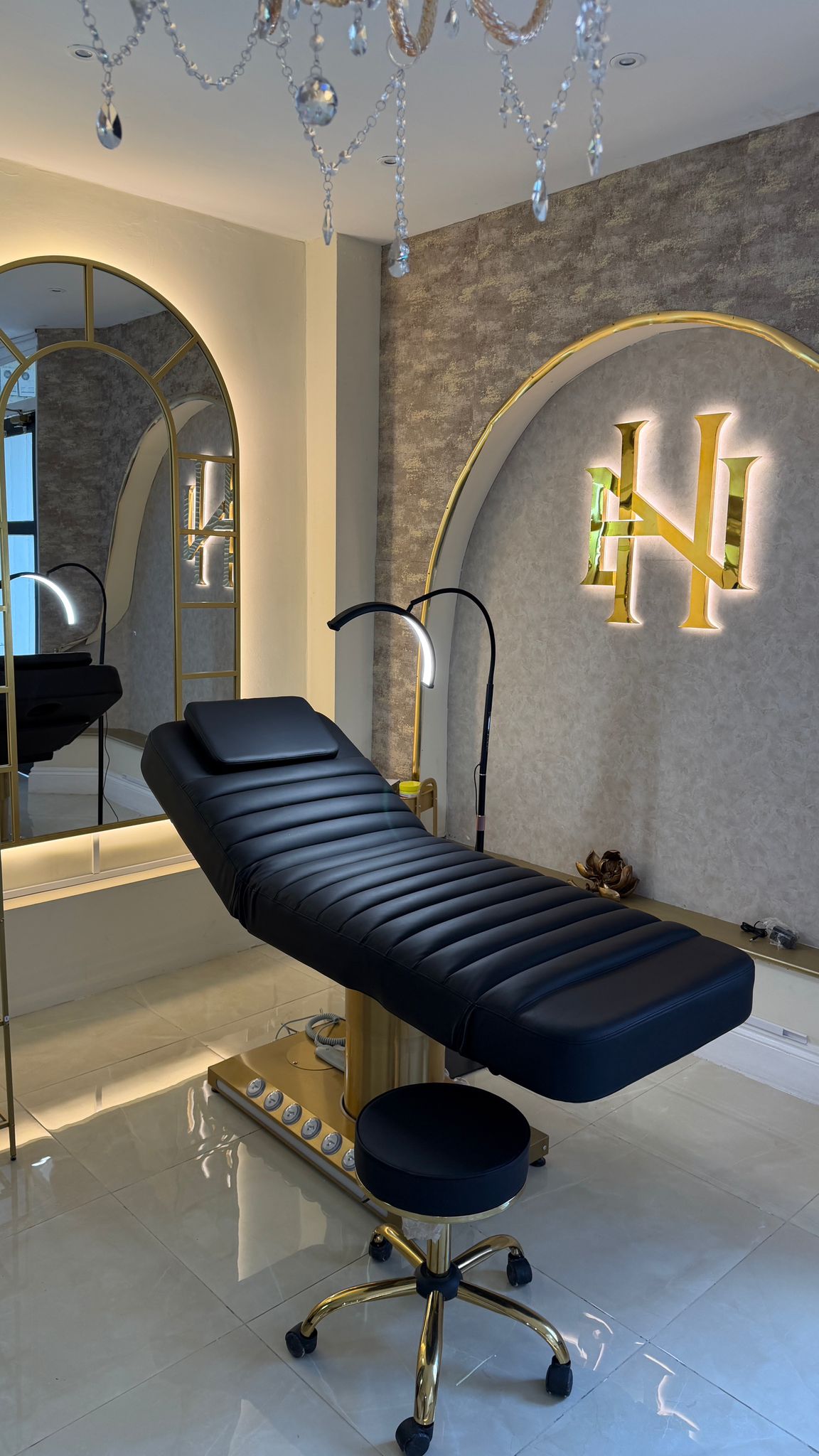 Treatment room with gold HN monogram